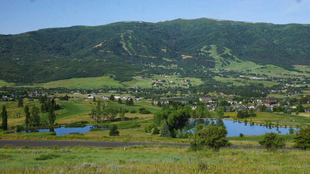 a view of the mountain and nearby neighborhood from Wolf Creek Public Golf Course