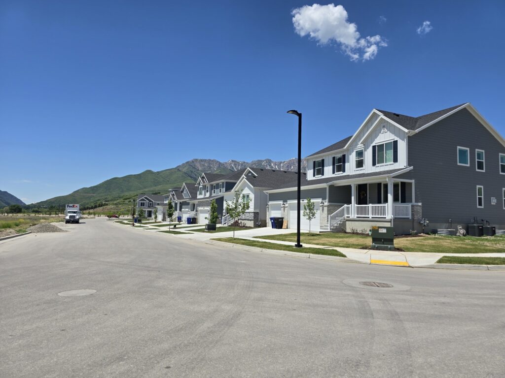 two story houses with garage and views of the mountains at the back
